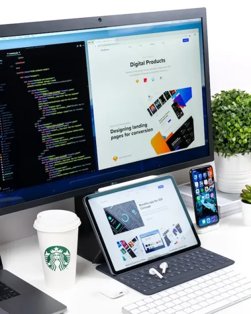 Web design workspace showing multiple devices and design tools